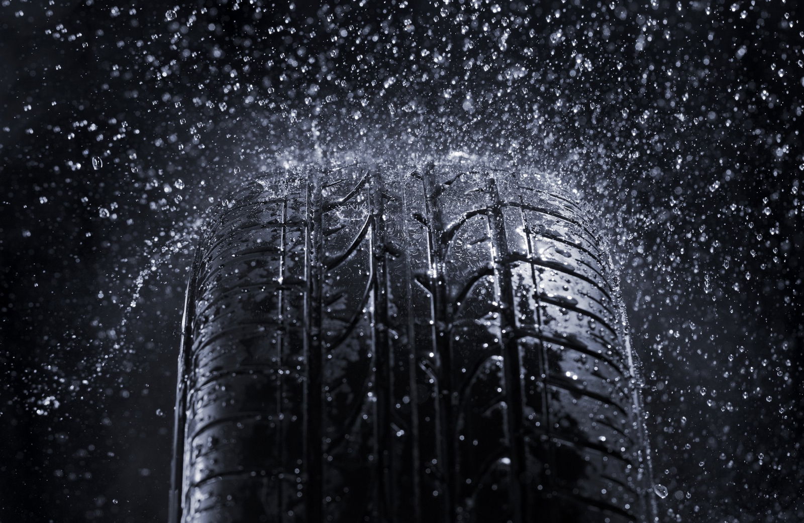 Car tire in rain